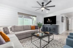 a living room with a couch and a table at Crown Azul - Old Town 2 Primary's New Pool Spa BBQ in Scottsdale