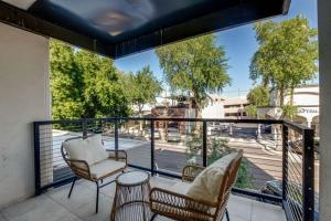 a balcony with chairs and a table and a view of a street at LUX at Craftsman - Heart of Old Town Studio 2 in Scottsdale