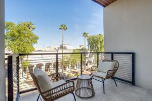 a balcony with chairs and a table on a balcony at The LUX at Craftsman - Old Town Penthouse 1 in Scottsdale
