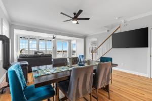 a dining room with a table and chairs at 3-BR Getaway on the Chesapeake Bay in North Beach