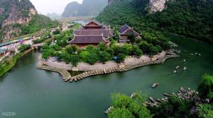 an aerial view of a river with a building on it at Wild Flower Homestay in Ninh Binh