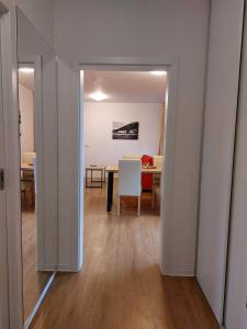 a living room with a table and a dining room at Apartmány NETA Velké Karlovice, Polanský Dvůr in Velké Karlovice