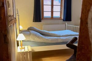 Ferienhof Rauchhaus tesisinde bir odada yatak veya yataklar
