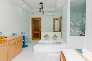 Postel nebo postele na pokoji v ubytování TNH Hotel Vung Tau + 37 fotografií