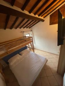 A bed or beds in a room at La Fortezza