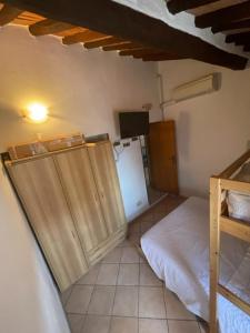 A bed or beds in a room at La Fortezza