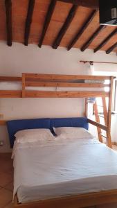 A bed or beds in a room at La Fortezza