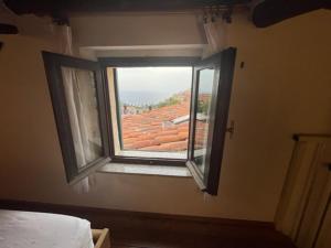 A bed or beds in a room at La Fortezza