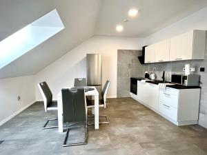 A kitchen or kitchenette at Apartmány PREMIUM se soukromým parkováním