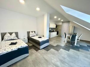A bed or beds in a room at Apartmány PREMIUM se soukromým parkováním