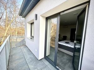 A balcony or terrace at Apartmány PREMIUM se soukromým parkováním