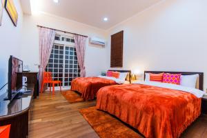 Voodi või voodid majutusasutuse Yilan Amy B&B toas