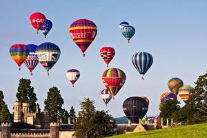 a bunch of hot air balloons in the sky at Large 2 story penthouse apartment, impressive views in Bristol