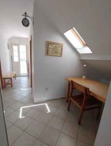 a dining room with a table and a skylight at Apartment Kumbor in Herceg-Novi
