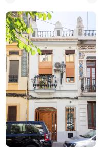 a black car parked in front of a building at Oasis de Valencia in Valencia