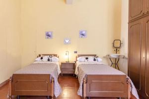 Ένα ή περισσότερα κρεβάτια σε δωμάτιο στο [Brisighella]Nel cuore del borgo