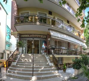 a building with stairs in front of it at Hotel Tiziana in Rimini +37 photos