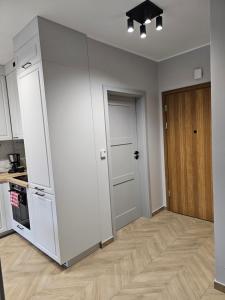 Η κουζίνα ή μικρή κουζίνα στο Apartament Konstancji +7 φωτογραφίες