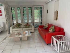 Uma área de estar em Condo-Resort Juquehy, 4 quartos