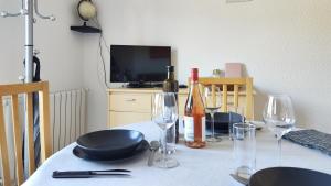 Televízia a/alebo spoločenská miestnosť v ubytovaní Appartement avec une belle vue sur Palalda