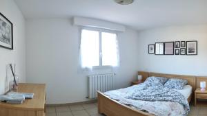 Posteľ alebo postele v izbe v ubytovaní Appartement avec une belle vue sur Palalda
