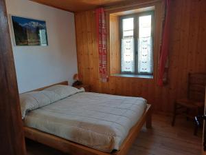 Łóżko lub łóżka w pokoju w obiekcie chalet Mont-Blanc