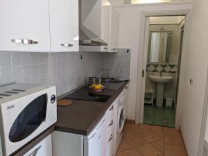 a kitchen with a sink and a counter top at Méditerranée in Minori