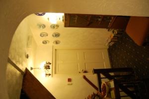 an overhead view of a hallway with a white door at Abbot's Haye in Cheadle