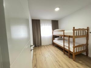 a small room with two bunk beds in it at Central Аpartment Foca with garage in Foča