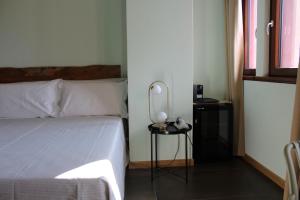 Postel nebo postele na pokoji v ubytování Bari Center Rooms