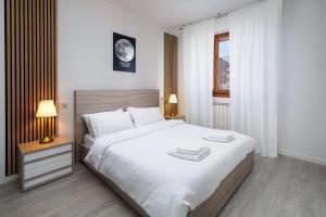 A bed or beds in a room at Apartment Forum