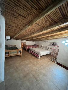 Postel nebo postele na pokoji v ubytování Mi casita de Los Andes Cabaña Familiar Apartaderos Merida