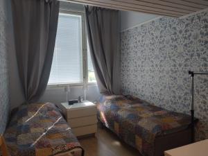 Ένα ή περισσότερα κρεβάτια σε δωμάτιο στο Summer Home