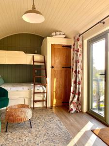 a bedroom with a bunk bed and a window at Bailey's Hideaway in Portadown