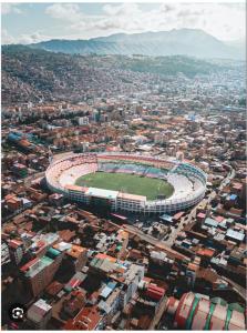 an aerial view of a soccer stadium in a city at Hotel Casa Shami in Cusco