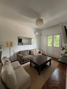 a living room with a couch and a coffee table at Apartamento en Montevideo in Montevideo