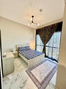 a bedroom with a bed and a window at Modern 1BR in Dubai South Mag5 with all utilities in Dubai