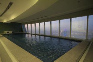 a hotel swimming pool with a view of the city at private Suite by Golden Hospitality 98 in Riyadh