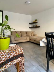 a living room with a couch and a table at Departamento amoblado in Villa María