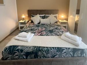 a bedroom with a large bed with two night stands at casa Hanna2 in Intra