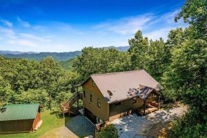 an aerial view of a house in the woods at Nantahala Nook, cabin w/hot tub,game room, & wifi in Bryson City