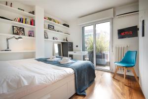 A bed or beds in a room at Giresio 41 - Your Penthouse with Rooftop Garden in Milano Navigli - WIFI