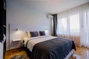 Rúm í herbergi á Victor Nest Double Room Apartment