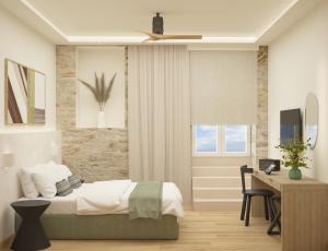 a bedroom with a bed and a desk at YeeOn Living-Well Boutique City Hotel Gythio in Gythio