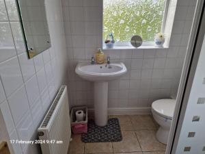 a bathroom with a sink and a toilet at The Annexe in Bridlington