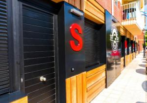 a s sign on the side of a building at Apartamentos surfing San Vicente II in San Vicente de la Barquera