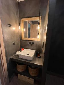 a bathroom with a sink and a mirror at G&A casa centrale in Ioannina
