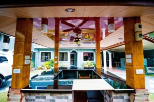 an open patio with a pool on a house at The Gabriella Bed and Breakfast in Tagbilaran City