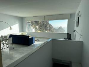 a living room with a view of a mountain at Casamar in Almería