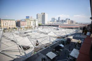 a large white building in a city with buildings at L'élégant BOUTIQUE ROOMS NAPLES in Naples